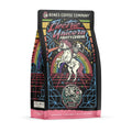 The front of a 12 ounce bag of Bones Coffee Company Electric Unicorn coffee. Its flavor is fruity cereal, and it has a skeleton riding a unicorn in front of a rainbow on the art.