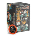 The front of the Bones Coffee Company Maple Bacon 12 Count Bones Cups box. Its flavor is bacon, and it has a skeleton dressed like a lumberjack sipping coffee in a forest with pigs on the art.