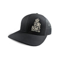 The front of the skull Bones Coffee Company logo trucker hat. The hat is black and the logo has the words Bones Coffee Co with a skull above it that looks like a mug with steam coming out of the top of it.